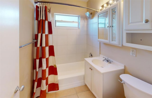 21456 Holdern Ave, Port Charlotte, FL 33952 - full bathroom with tile patterned flooring, toilet, vanity, and shower / bathtub combination with curtain