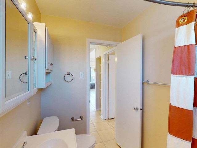 21456 Holdern Ave, Port Charlotte, FL 33952 - bathroom with tile patterned floors and toilet