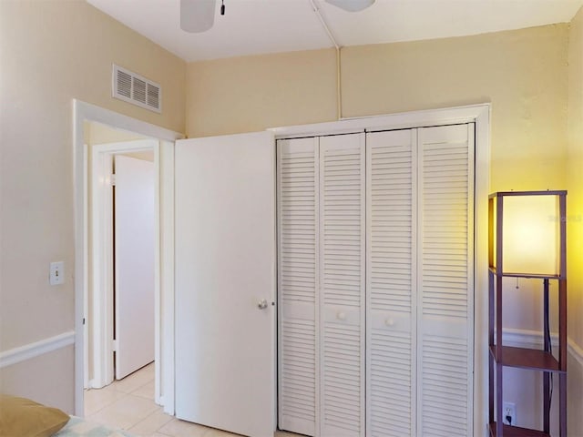 21456 Holdern Ave, Port Charlotte, FL 33952 - unfurnished bedroom featuring a closet, ceiling fan, and light tile patterned floors