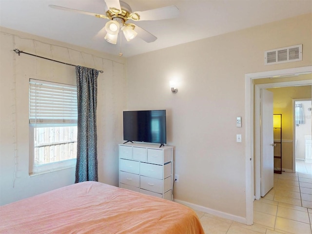 21456 Holdern Ave, Port Charlotte, FL 33952 - bedroom with ceiling fan and light tile patterned floors