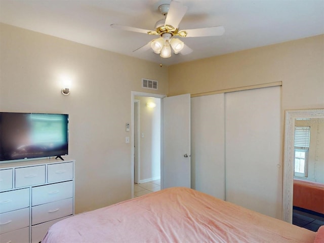 21456 Holdern Ave, Port Charlotte, FL 33952 - bedroom featuring ceiling fan, light tile patterned floors, and a closet