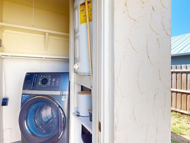 21456 Holdern Ave, Port Charlotte, FL 33952 - laundry room with electric water heater and washer / dryer