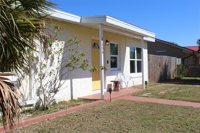 21456 Holdern Ave, Port Charlotte, FL 33952 - view of home's exterior with a yard
