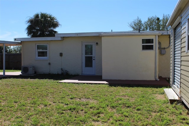 21456 Holdern Ave, Port Charlotte, FL 33952 - back of property with a yard and ac unit