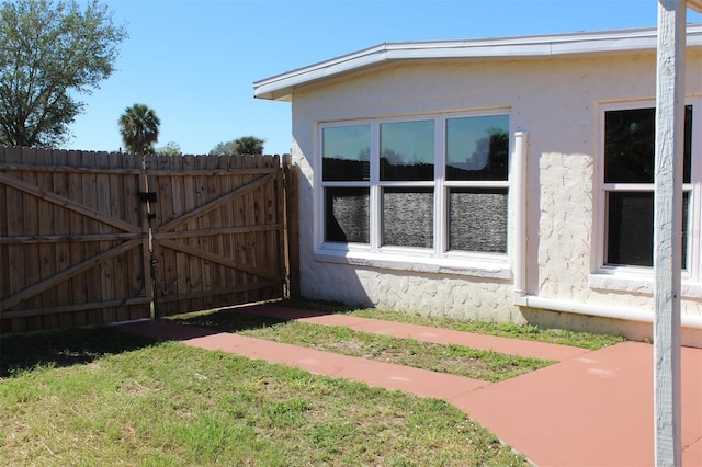 21456 Holdern Ave, Port Charlotte, FL 33952 - view of property exterior featuring a yard