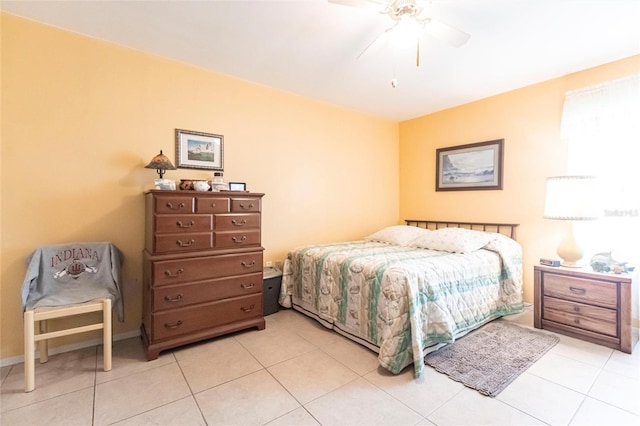 tiled bedroom with ceiling fan