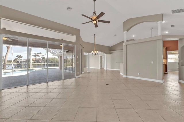 unfurnished living room with visible vents, a wealth of natural light, and ceiling fan with notable chandelier