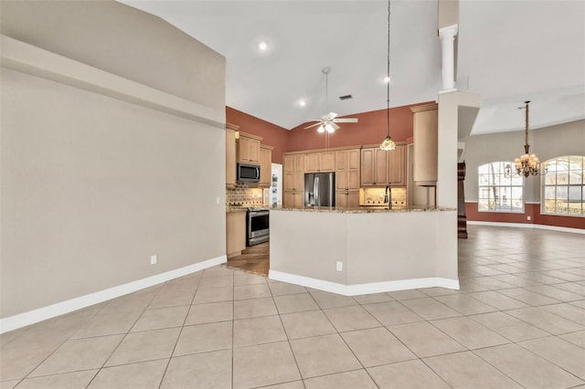 kitchen featuring open floor plan, appliances with stainless steel finishes, light tile patterned flooring, and backsplash