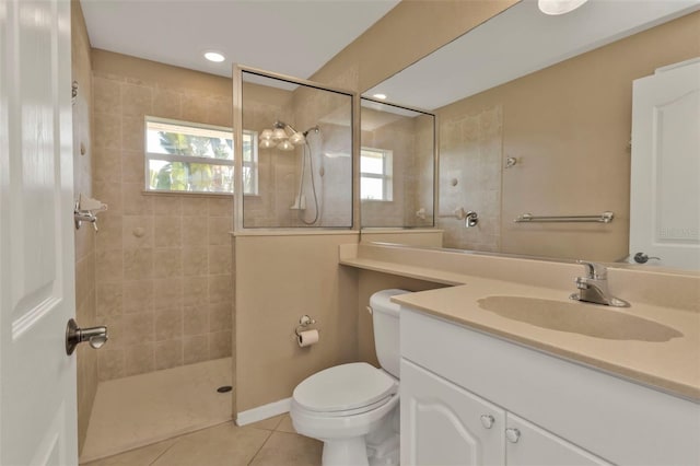 bathroom featuring tile patterned flooring, toilet, recessed lighting, vanity, and walk in shower