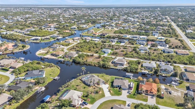 aerial view featuring a water view and a residential view