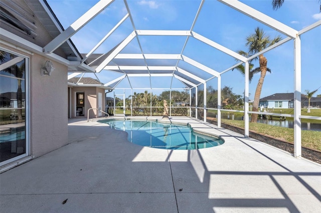 outdoor pool with a lanai, a water view, and a patio area