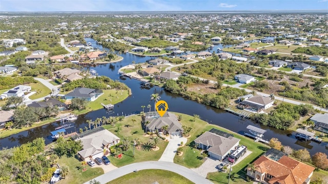 drone / aerial view with a residential view and a water view