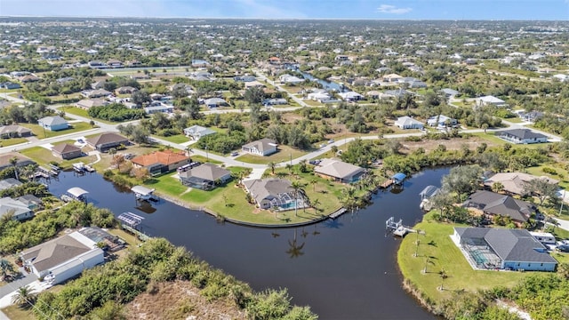 aerial view featuring a water view and a residential view