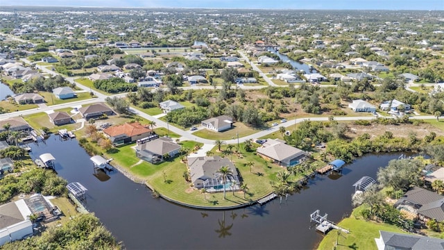 bird's eye view with a residential view and a water view