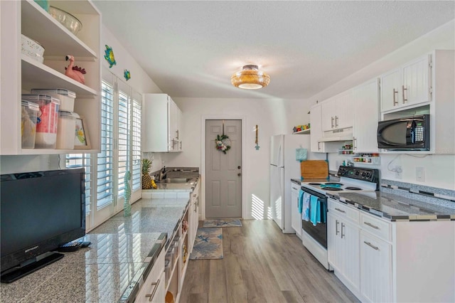 kitchen featuring white cabinetry, sink, white appliances, a textured ceiling, and light hardwood / wood-style flooring