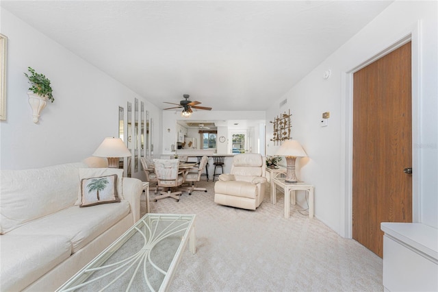 living room featuring ceiling fan and carpet flooring