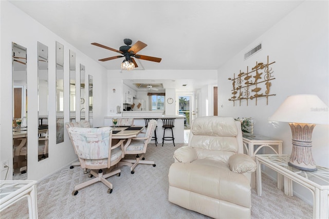 interior space with light carpet and ceiling fan