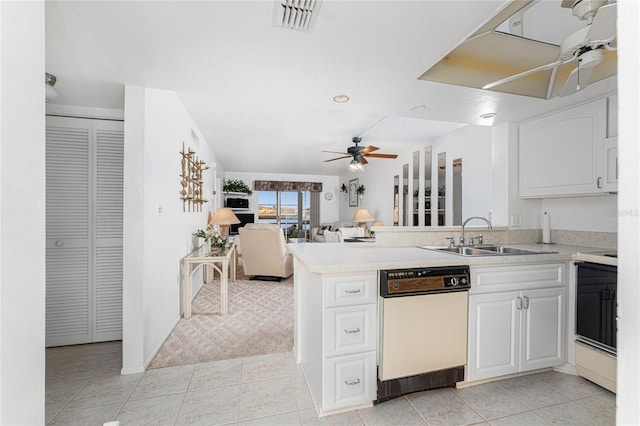 kitchen featuring sink, white cabinetry, light tile patterned floors, kitchen peninsula, and ceiling fan