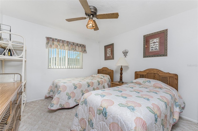 bedroom with ceiling fan and light colored carpet