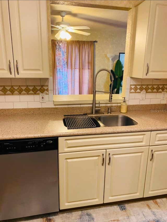 kitchen featuring white cabinetry, dishwasher, sink, and tasteful backsplash