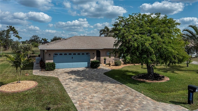 single story home featuring a garage and a front yard