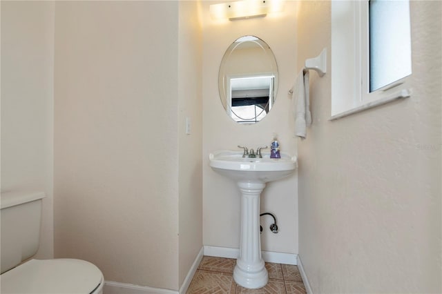 bathroom featuring toilet