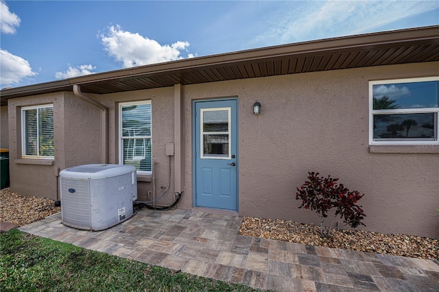 entrance to property featuring a patio