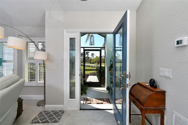 entryway with a textured ceiling