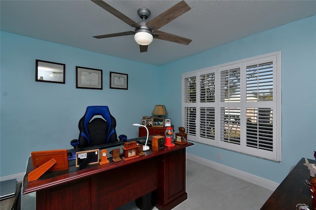 office space featuring a textured ceiling and ceiling fan