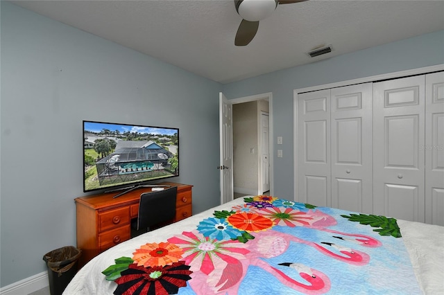 bedroom with ceiling fan and a closet