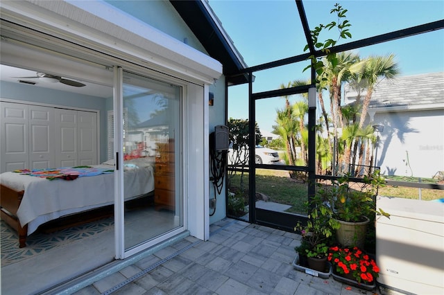 sunroom / solarium with a healthy amount of sunlight and ceiling fan