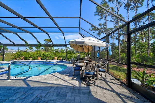 view of pool featuring a patio and glass enclosure