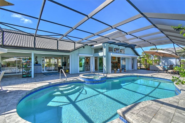 view of swimming pool with an in ground hot tub, glass enclosure, and a patio