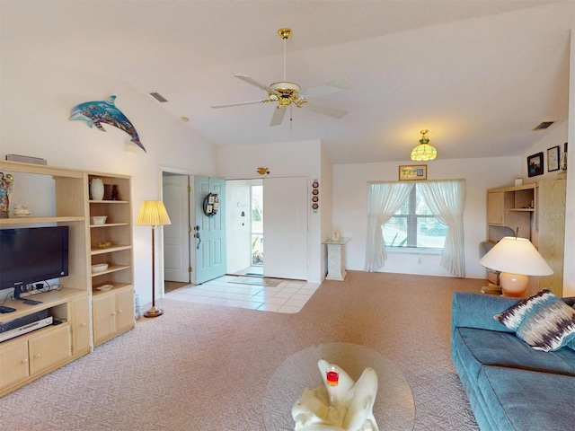 living room featuring light carpet, vaulted ceiling, and ceiling fan