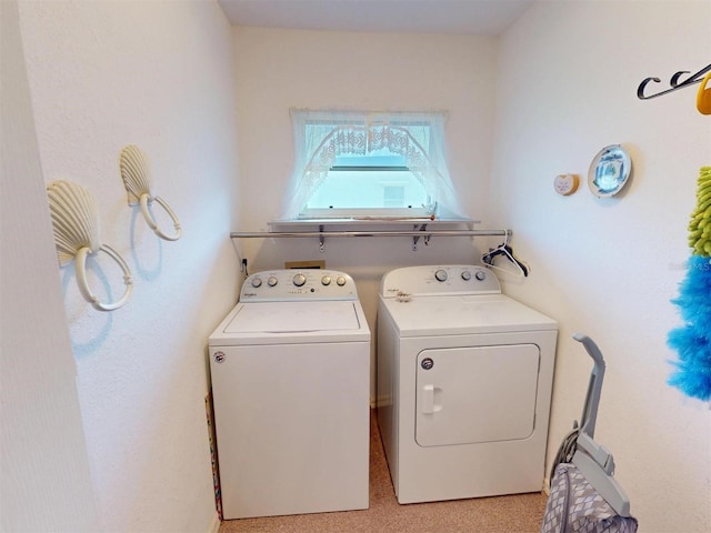 laundry area featuring washing machine and clothes dryer