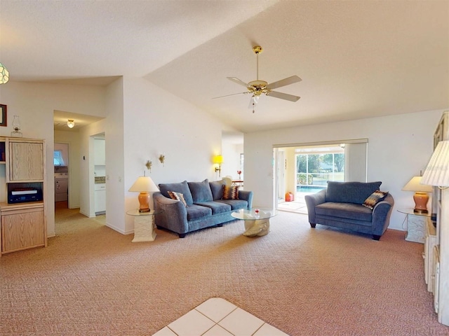 carpeted living room featuring ceiling fan and lofted ceiling