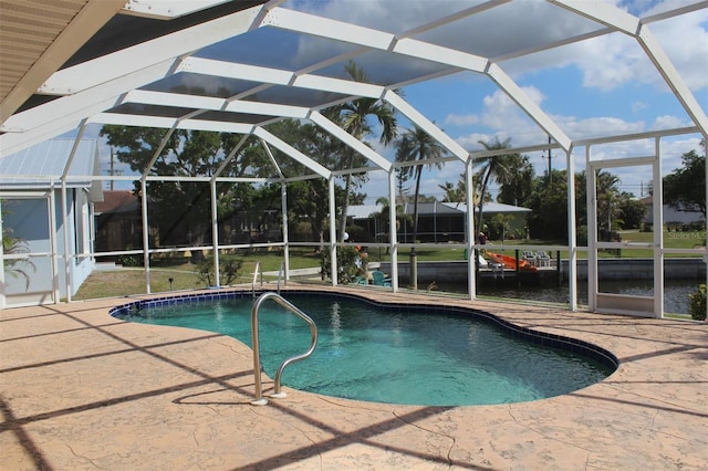 view of swimming pool with a lanai and a patio area