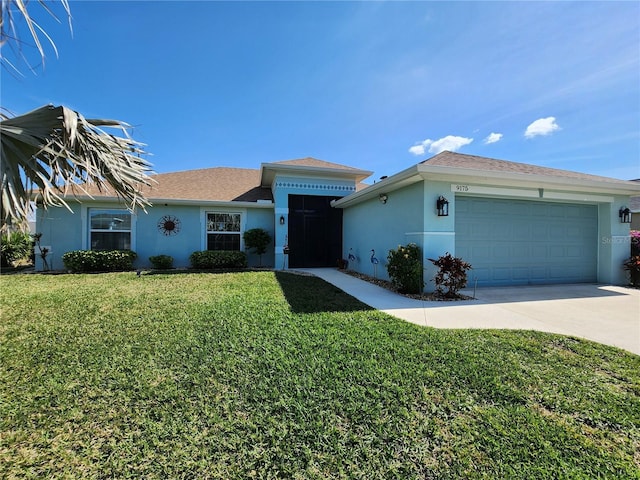 ranch-style home featuring a garage and a front lawn