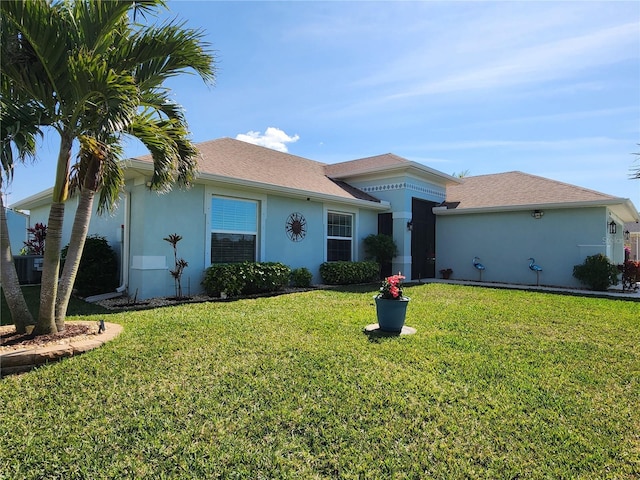 ranch-style house featuring a front yard