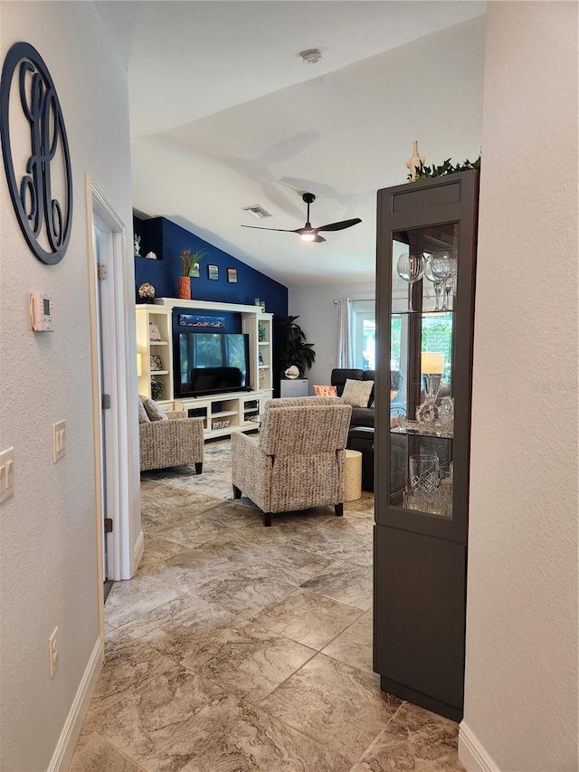 living room with lofted ceiling and ceiling fan