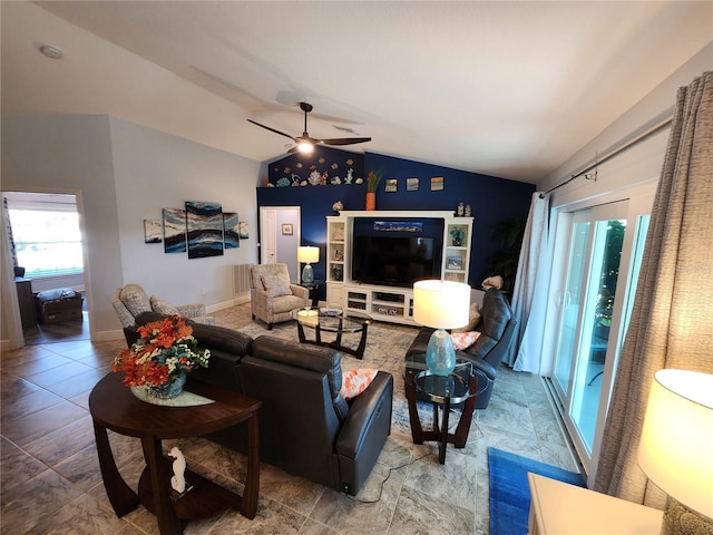 living room with ceiling fan and vaulted ceiling