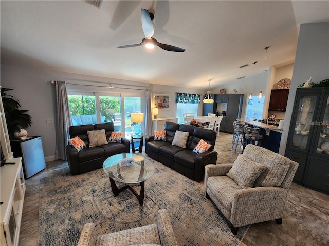 living room featuring lofted ceiling and ceiling fan