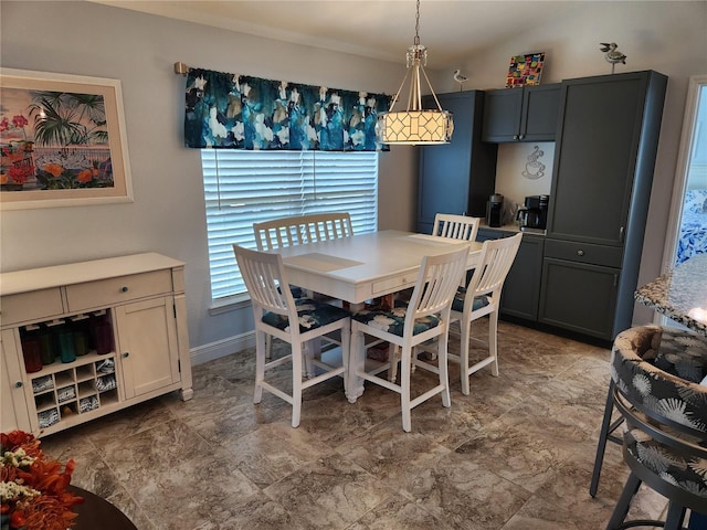 dining area featuring lofted ceiling