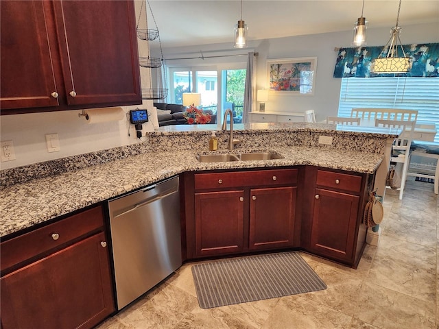 kitchen featuring pendant lighting, sink, dishwasher, light stone counters, and kitchen peninsula