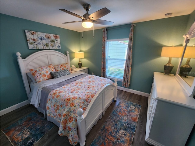 bedroom featuring dark wood-type flooring and ceiling fan