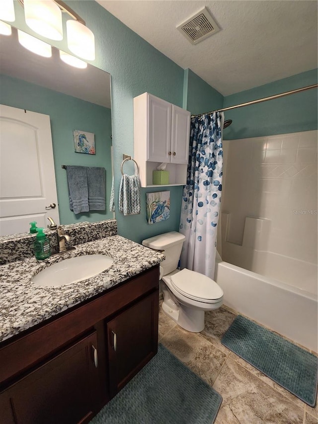 full bathroom with vanity, toilet, and shower / bath combo