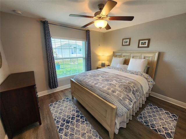 bedroom featuring dark hardwood / wood-style floors and ceiling fan