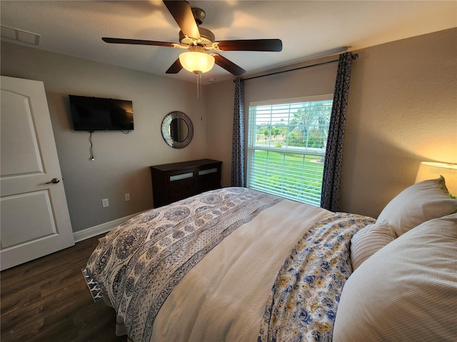 bedroom featuring dark wood-type flooring and ceiling fan