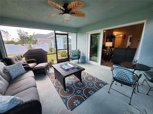 sunroom with ceiling fan