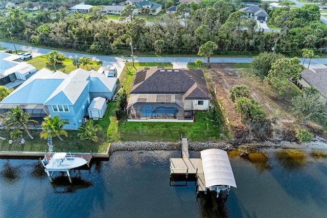 birds eye view of property featuring a water view